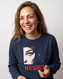 gravisk Resist v1 graphic sweatshirt in organic cotton. Half a face with one open eye, red lashes and the word resist in worn red.