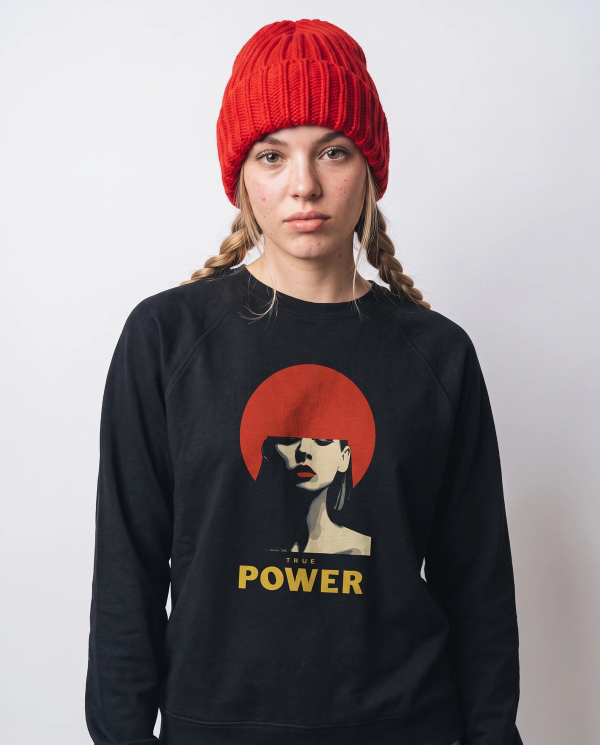 gravisk True Power graphic sweatshirt in organic cotton. Minimal portrait with a red bob and the words true power in gold.