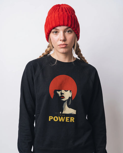 gravisk True Power graphic sweatshirt in organic cotton. Minimal portrait with a red bob and the words true power in gold.