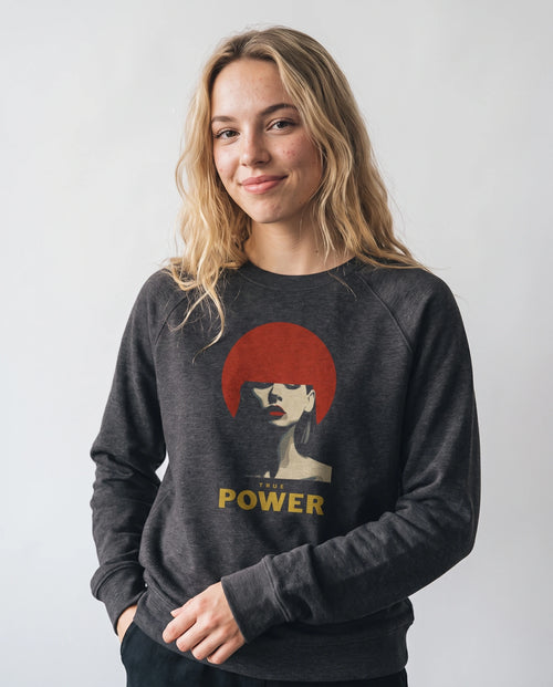 gravisk True Power graphic sweatshirt in organic cotton. Minimal portrait with a red bob and the words true power in gold.