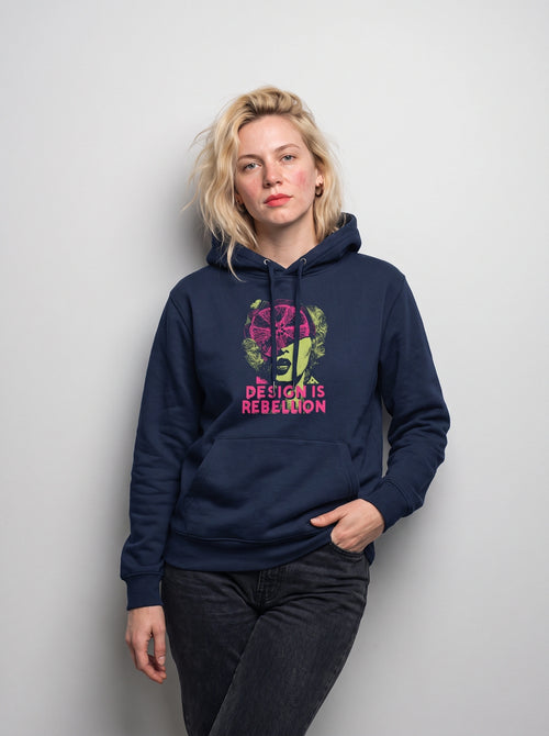 gravisk Design Is Rebellion graphic hoodie in organic cotton. Baroque portrait in acid green with a magenta citrus slice, DESIGN IS REBELLION in hot pink.