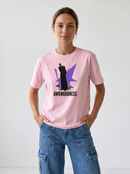 gravisk Awkwardness organic graphic tee. A dark figure in front of a lavender starburst, AWKWARDNESS in black caps below.