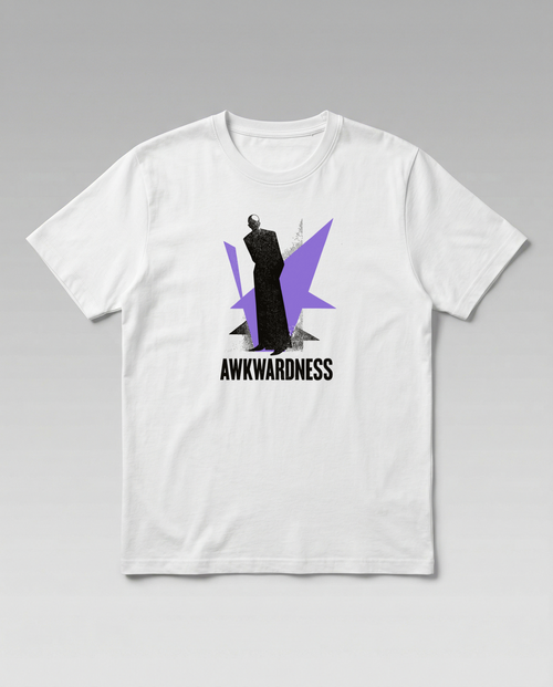 gravisk Awkwardness organic graphic tee. A dark figure in front of a lavender starburst, AWKWARDNESS in black caps below.