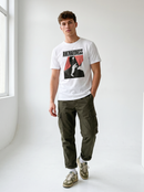 gravisk Awkwardness organic graphic tee. Heavy gothic type, a hand over the face, a red diamond cutting through.