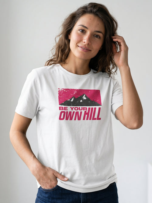 gravisk Be Your Own Hill organic graphic tee. A dark mountain range in a worn magenta field: not the peak, the whole hill.