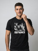 gravisk Defiance organic graphic tee. High-contrast scene of four figures standing their ground in urban ruins.