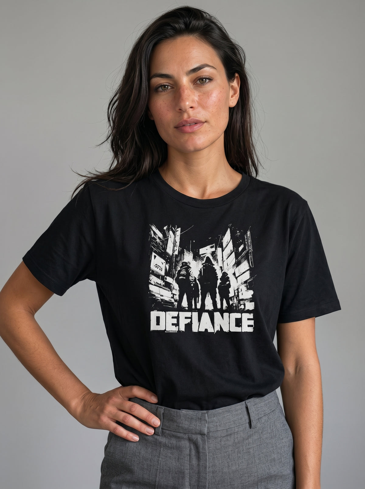 gravisk Defiance organic graphic tee. High-contrast scene of four figures standing their ground in urban ruins.