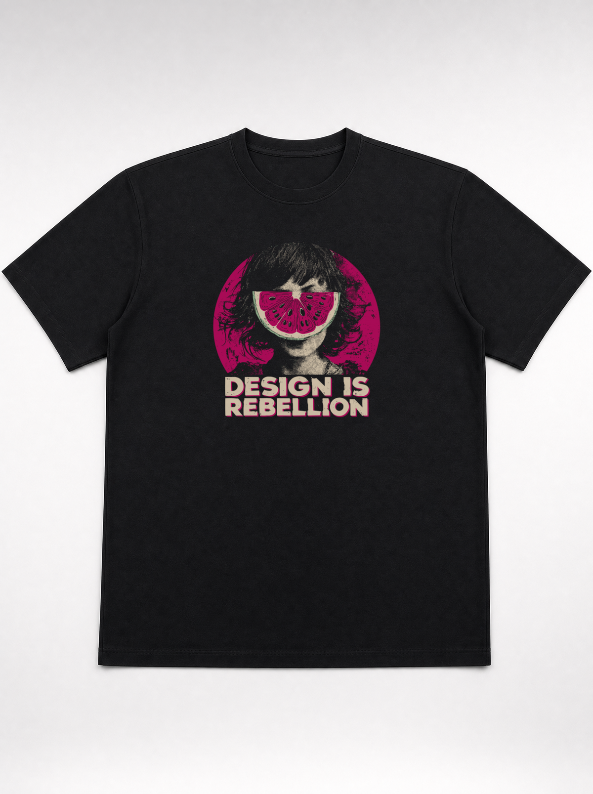 gravisk Design Is Rebellion organic graphic tee. Half-tone portrait with a watermelon mask in a magenta circle.