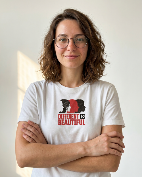gravisk Different Is Beautiful organic graphic tee. Three profiles in red and black above DIFFERENT IS BEAUTIFUL.