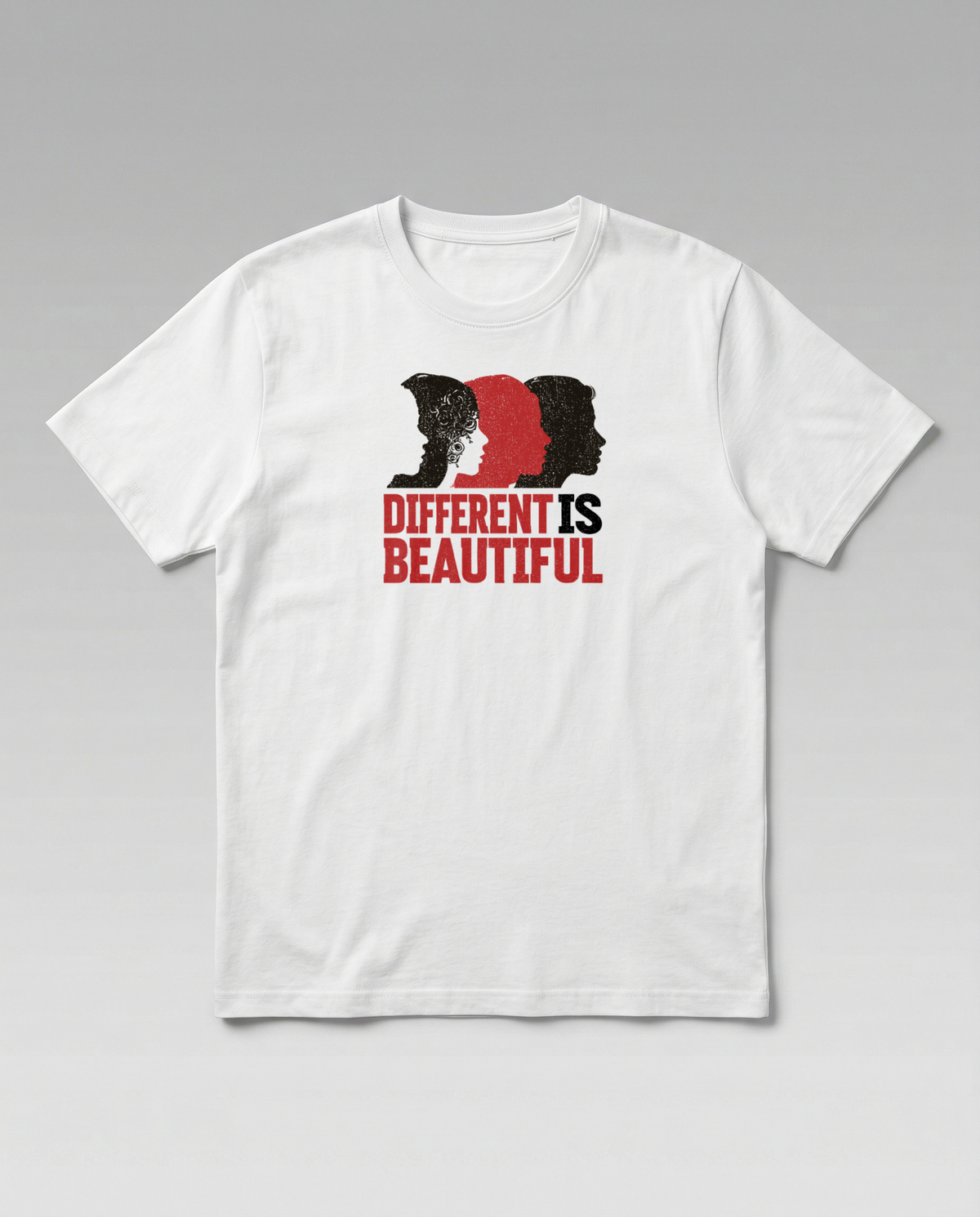 gravisk Different Is Beautiful organic graphic tee. Three profiles in red and black above DIFFERENT IS BEAUTIFUL.