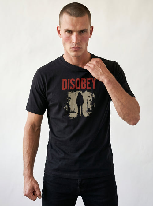 gravisk Disobey organic graphic tee. Distressed red DISOBEY type over a lone figure in an empty street.