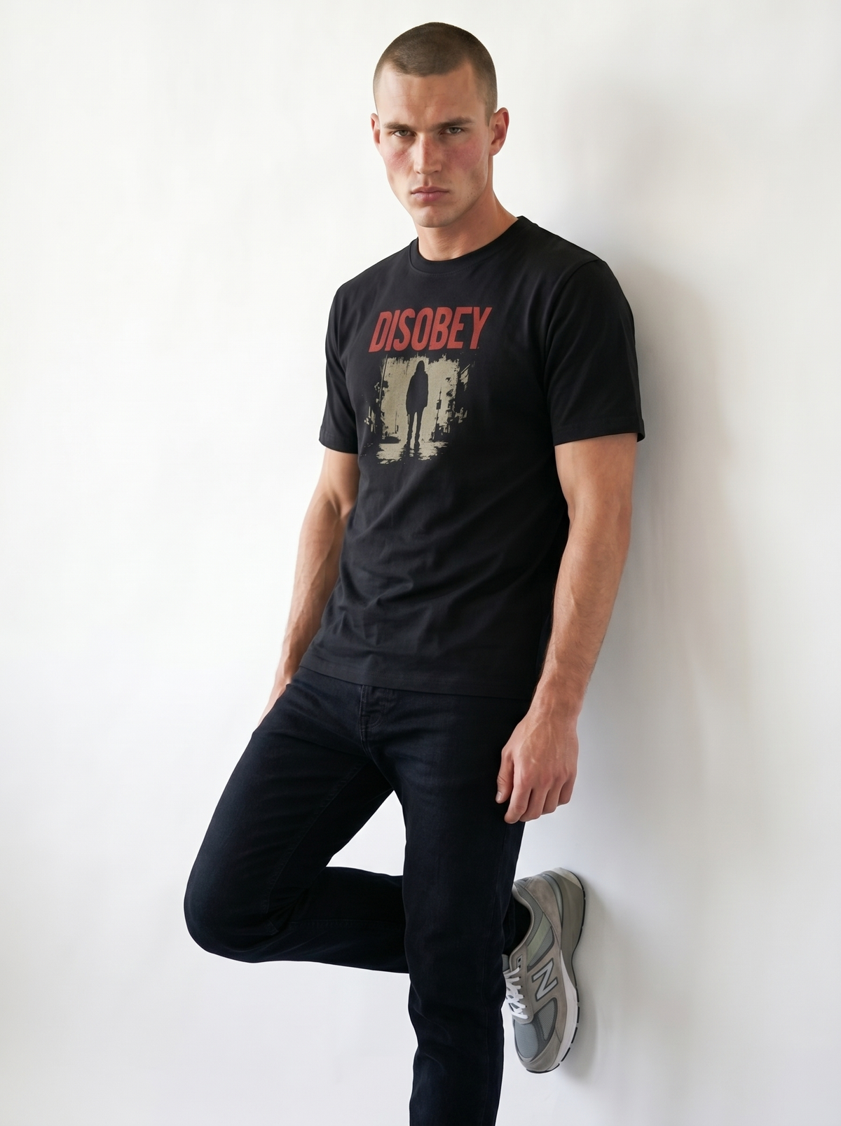 gravisk Disobey organic graphic tee. Distressed red DISOBEY type over a lone figure in an empty street.
