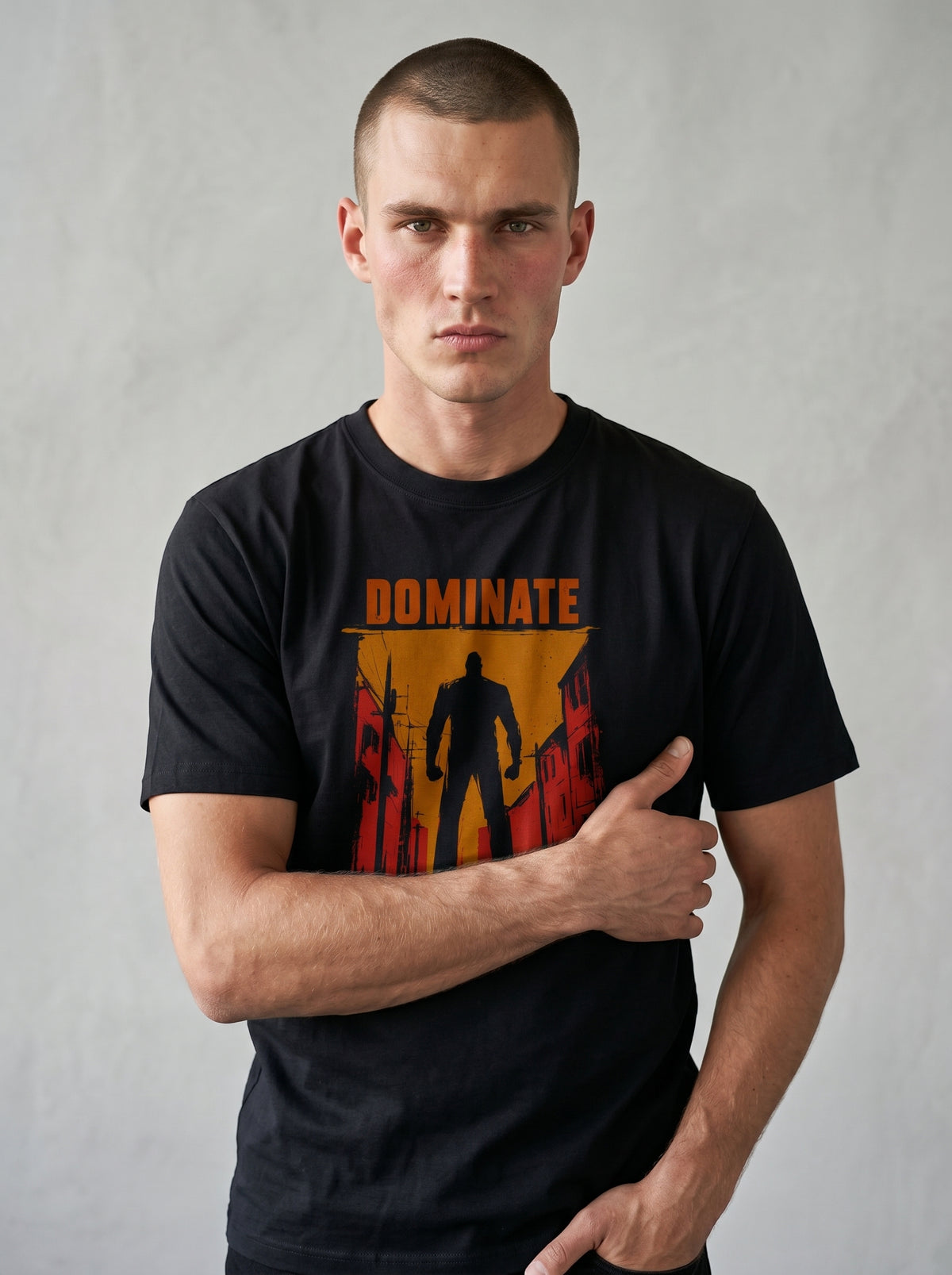 gravisk Dominate organic graphic tee. A lone silhouette in a burning amber street, DOMINATE in heavy caps above.