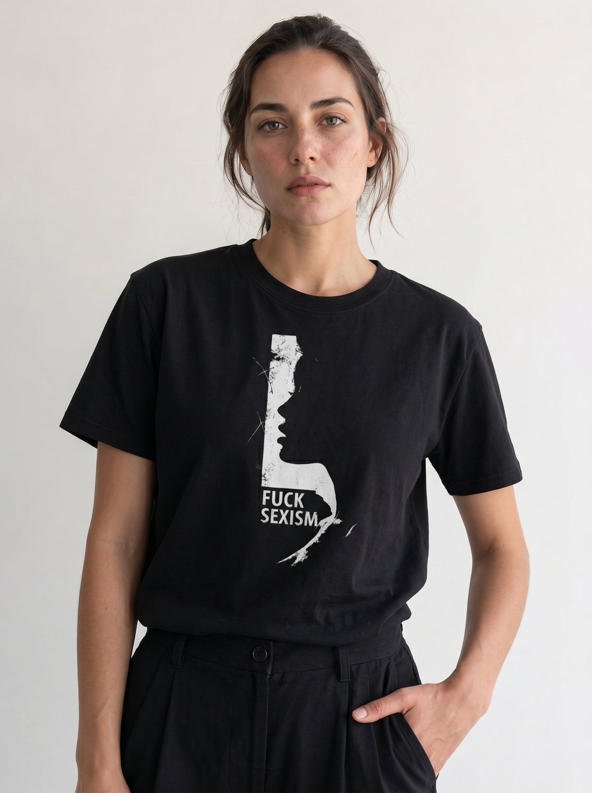 gravisk F*ck Sexism organic graphic tee. Distressed white profile silhouette with FUCK SEXISM set inside it.