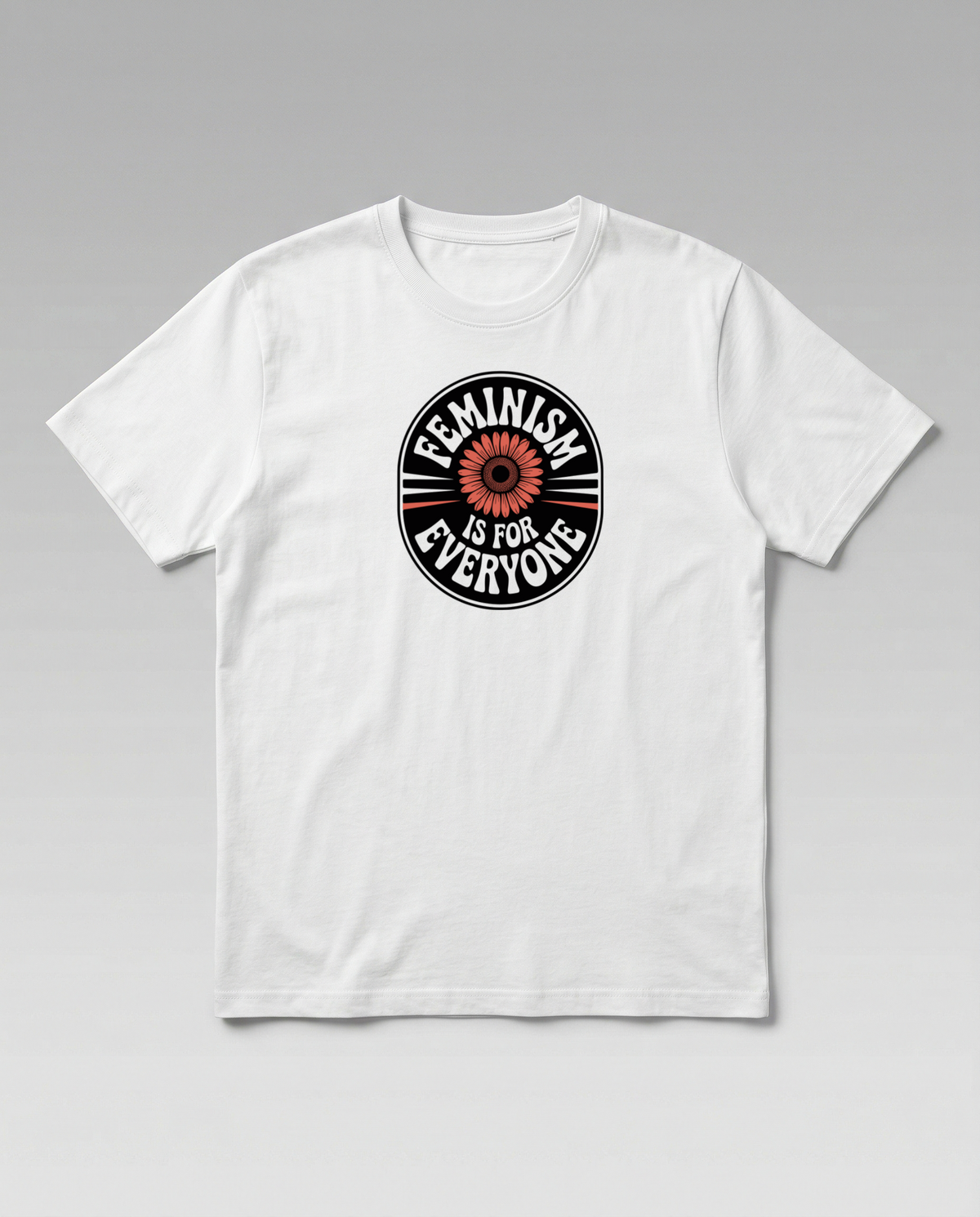 gravisk Feminism Is for Everyone organic graphic tee. Circular emblem with a coral flower and curved FEMINISM IS FOR EVERYONE type.