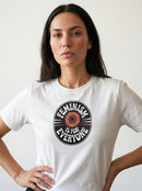 gravisk Feminism Is for Everyone organic graphic tee. Circular emblem with a coral flower and curved FEMINISM IS FOR EVERYONE type.