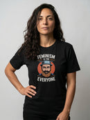 gravisk Feminism Is for Everyone organic graphic tee. A bearded man in a hat against a retro sun, knitting needles below, EVERYONE.