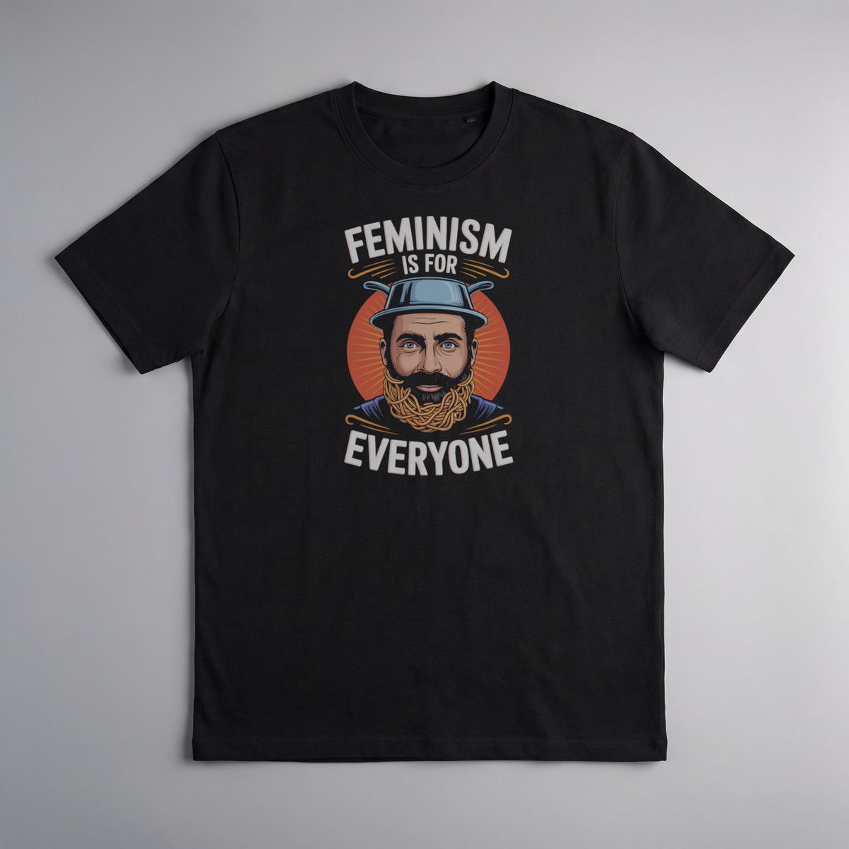 gravisk Feminism Is for Everyone organic graphic tee. A bearded man in a hat against a retro sun, knitting needles below, EVERYONE.