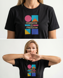 gravisk Feminism Is Freedom organic graphic tee. Bauhaus shapes in pink, teal, yellow and cobalt around cream FEMINISM IS FREEDOM type.
