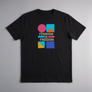 gravisk Feminism Is Freedom organic graphic tee. Bauhaus shapes in pink, teal, yellow and cobalt around cream FEMINISM IS FREEDOM type.