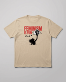 gravisk Feminism Is Fun organic graphic tee. A leaping woman flying a raised-fist kite, red FEMINISM IS FUN type.