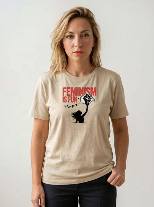 gravisk Feminism Is Fun organic graphic tee. A leaping woman flying a raised-fist kite, red FEMINISM IS FUN type.