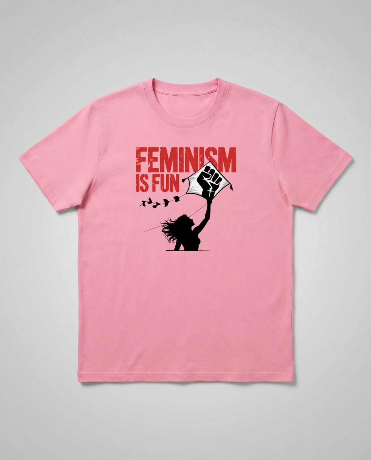 gravisk Feminism Is Fun organic graphic tee. A leaping woman flying a raised-fist kite, red FEMINISM IS FUN type.