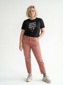 gravisk I Don't Need Your Applause organic graphic tee. A face dissolving into particles, only pink lips intact, Applause in script.