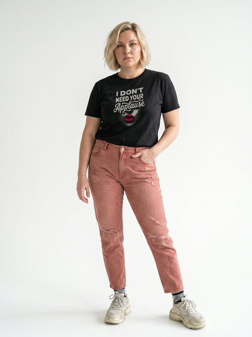 gravisk I Don't Need Your Applause organic graphic tee. A face dissolving into particles, only pink lips intact, Applause in script.