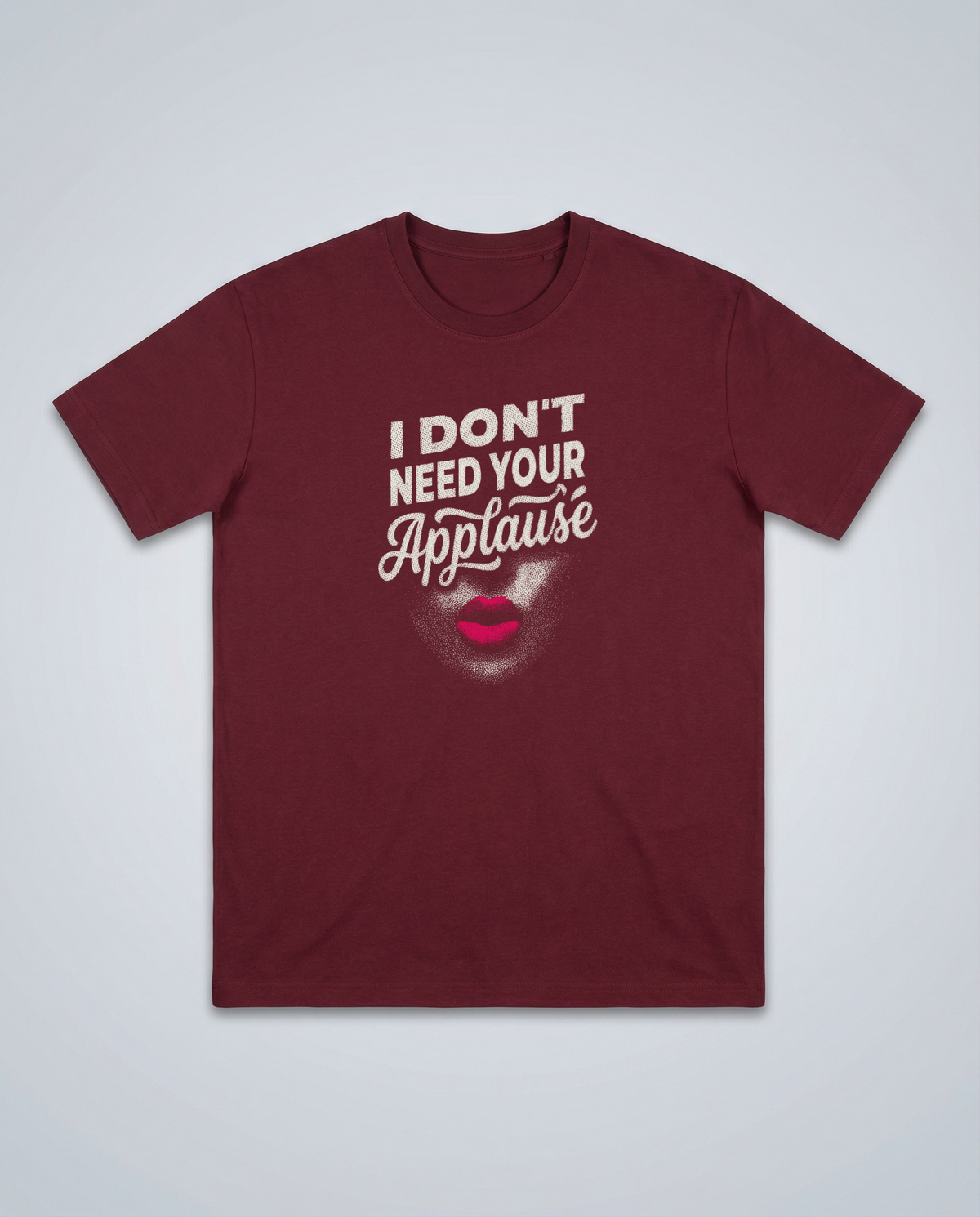 gravisk I Don't Need Your Applause organic graphic tee. A face dissolving into particles, only pink lips intact, Applause in script.