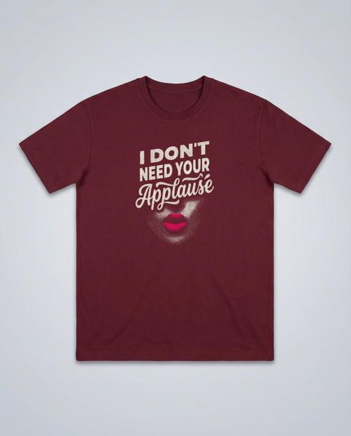 gravisk I Don't Need Your Applause organic graphic tee. A face dissolving into particles, only pink lips intact, Applause in script.