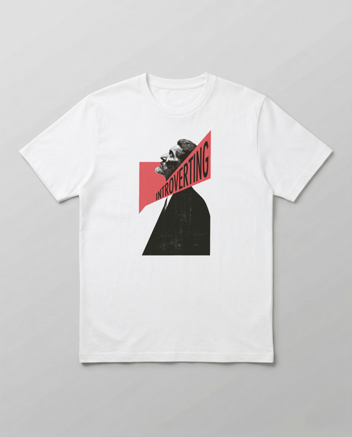 gravisk Introverting organic graphic tee. A tilted profile portrait cut by a red diagonal band reading INTROVERTING.