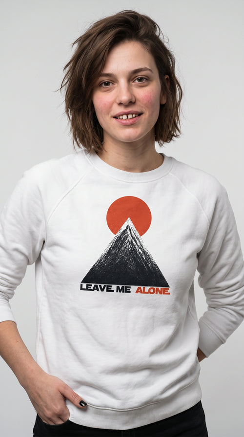 gravisk Leave Me Alone graphic sweatshirt in organic cotton. Minimal mountain with the sun behind it and the words leave me alone.