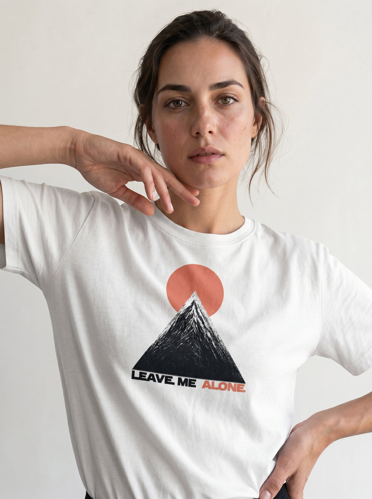 gravisk Leave Me Alone organic graphic tee. Hand-drawn mountain under a red sun, ALONE in red.