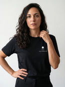 gravisk Love Minimalism organic graphic tee. Small chest print: an architectural icon above LOVE MINIMALISM lettering.