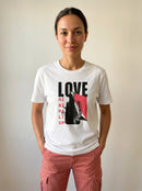 gravisk Love Minimalism organic graphic tee. LOVE in block type, MINIMALISM in a vertical column beside a reaching figure.