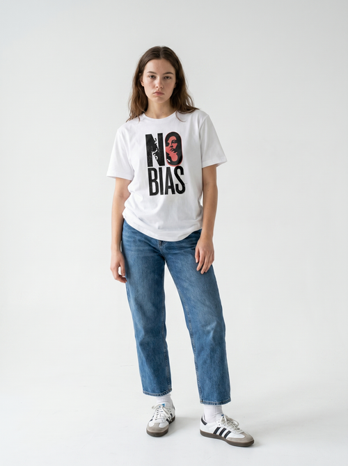 gravisk No Bias organic graphic tee. Heavy serif NO BIAS with a terracotta portrait inside the letter O.