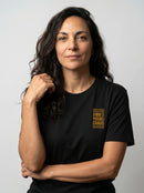 gravisk Own Your Chaos organic graphic tee. Compact amber chest print framed in thin bars.