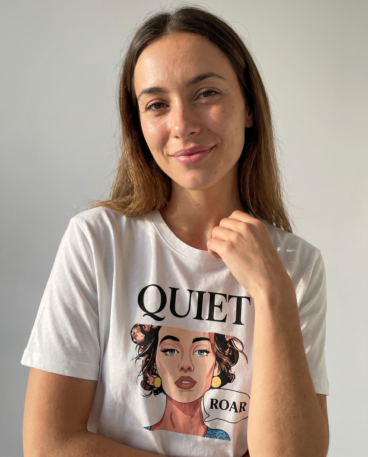 gravisk Quiet Roar organic graphic tee. Pop-art portrait between QUIET and a small ROAR speech bubble.