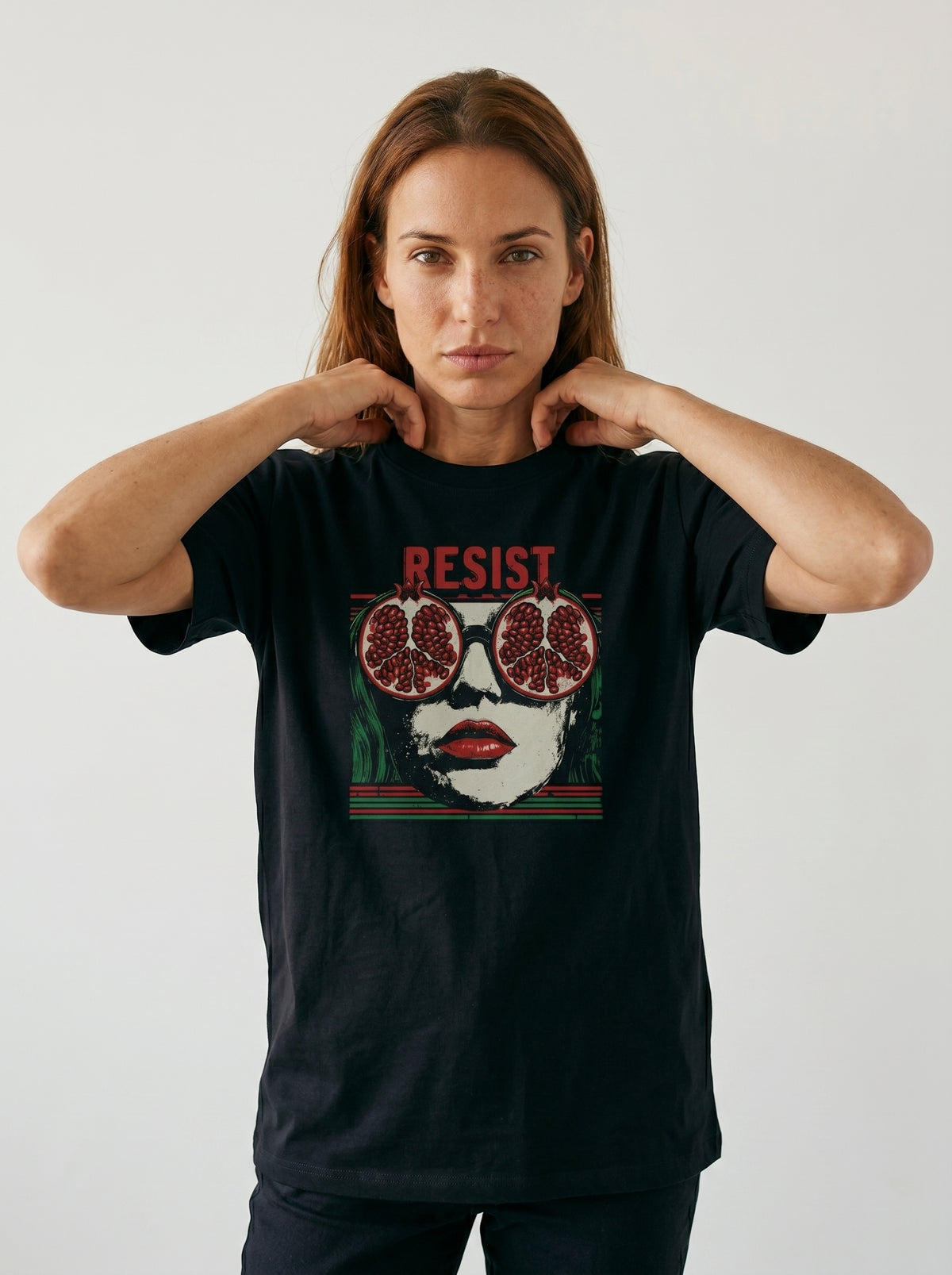 gravisk Resist organic graphic tee. Pop-art portrait with pomegranate lenses, distressed red RESIST above.