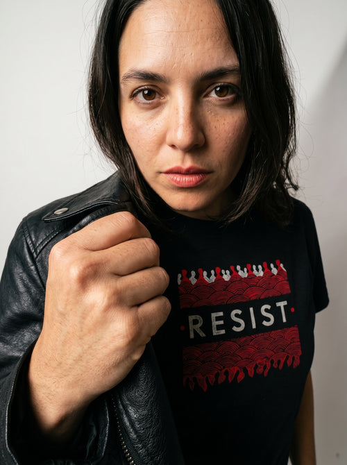 gravisk Resist organic graphic tee. White RESIST between two bands of churning red and black texture.