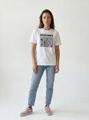 gravisk Resistance organic graphic tee. Hand-drawn panel of plants, faces and symbols in black line work, RESISTANCE above.