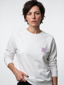 gravisk Self-Care Is Not Selfish chest print sweatshirt in organic cotton. Small lilac speech bubble on the left chest.