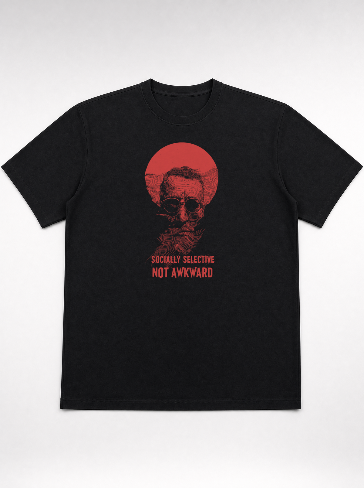 gravisk Socially Selective, Not Awkward organic graphic tee. A man in round glasses, hand over his mouth, inside a red circle.