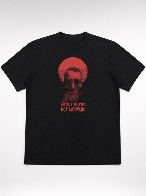 gravisk Socially Selective, Not Awkward organic graphic tee. A man in round glasses, hand over his mouth, inside a red circle.