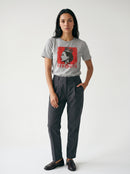 gravisk Strength organic graphic tee. A crowned profile on a distressed red square, STRENGTH in red serif.