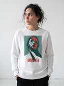 gravisk Unbroken graphic sweatshirt in organic cotton. Portrait split like shattered glass in teal and red with the word unbroken.