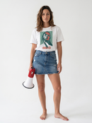 gravisk Unbroken organic graphic tee. Cracked green and red portrait, a hand across the face, UNBROKEN.