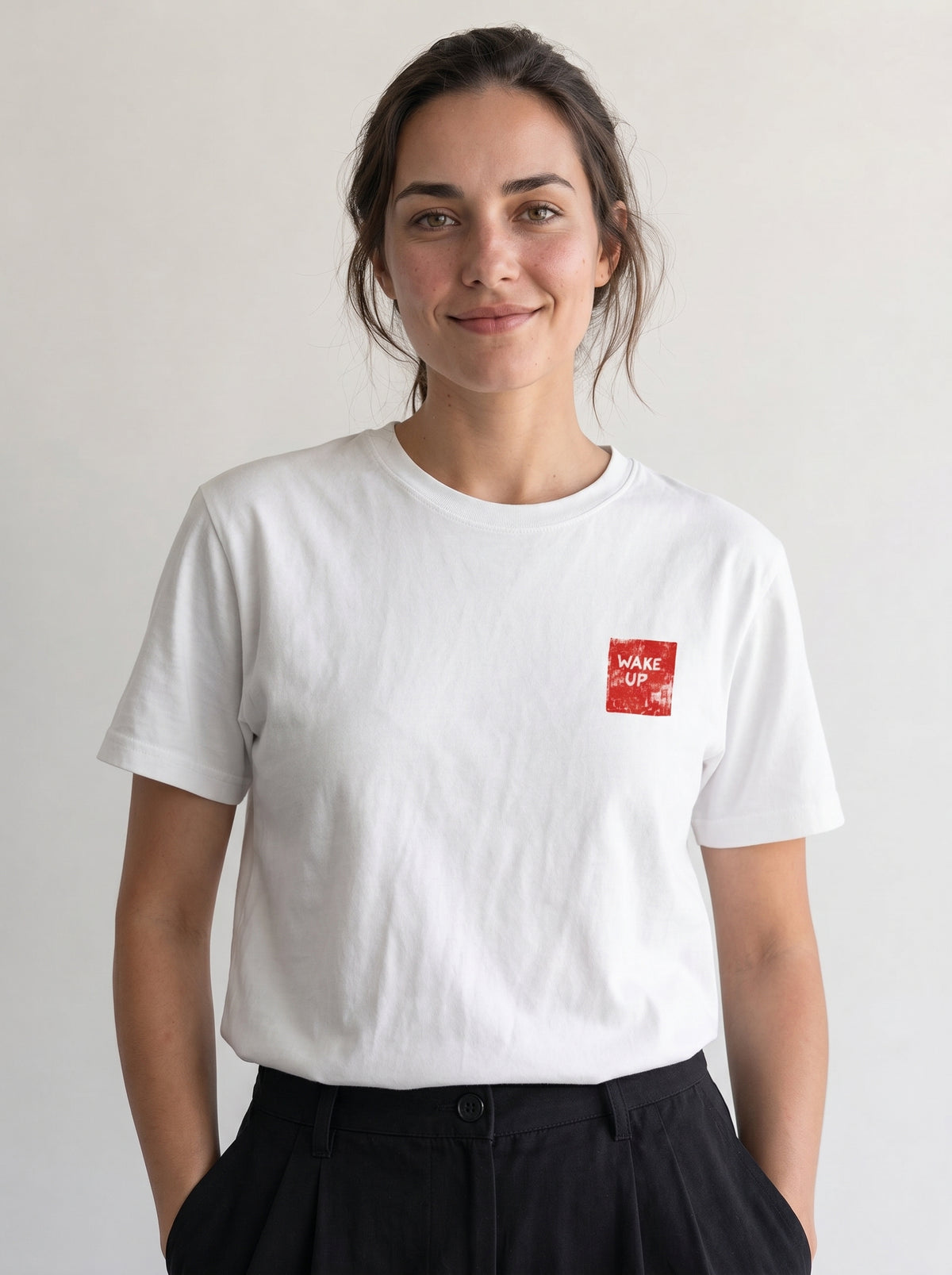 gravisk Wake Up organic graphic tee. Small WAKE UP chest print, large KEEP GOING red square on the back.