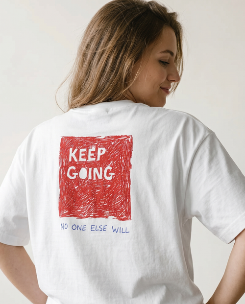 gravisk Wake Up organic graphic tee. Small WAKE UP chest print, large KEEP GOING red square on the back.